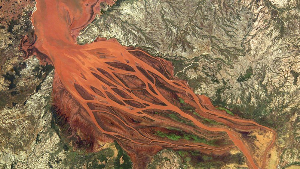 Picture of The Betsiboka Estuary taken from space after heavy rainfall. It ow looks like blood red veins instead of blue water