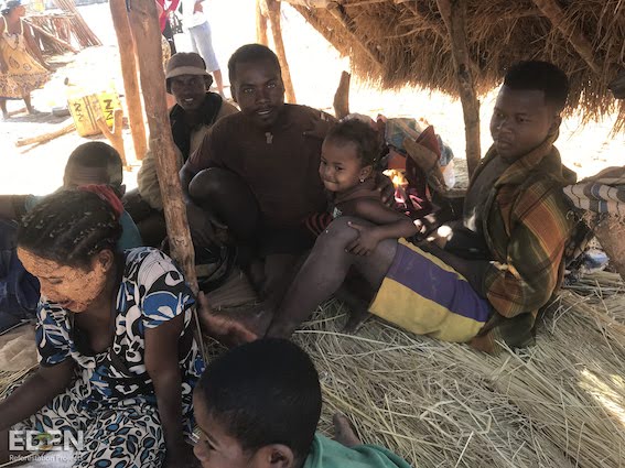 Photo of the local community members sat in huts at our Bemangoraka site
